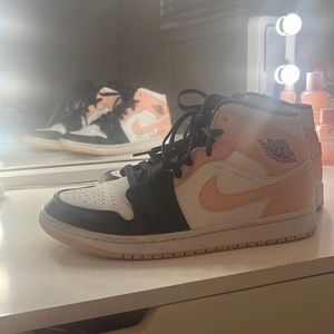 Arctic orange black toe jordan 1 mids.